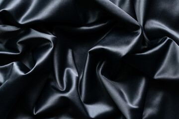Wall Mural - Black silk luxury abstract texture and background with folds.
