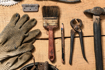 Old vintage household hand tools still life on a wooden background in a DIY and repair concept