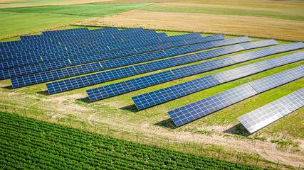 Canvas Print - Solar panels on field in summer, aerial view of Poland