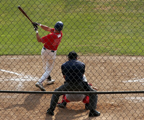 Wall Mural - View of athletes playing baseball in the field