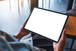 © Farknot Architect - Mockup image of a woman holding digital tablet with blank white desktop screen