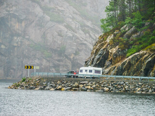 Sticker - Car with trailer on road in norwegian mountains