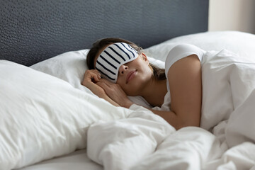 stylish nightwear. comfy sleeping mask helping young woman tourist traveler enjoy good healthy night