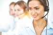 © rogerphoto - Call center. Focus on beautiful business woman in headset
