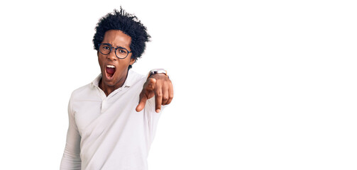 Sticker - Handsome african american man with afro hair wearing casual clothes and glasses pointing displeased and frustrated to the camera, angry and furious with you