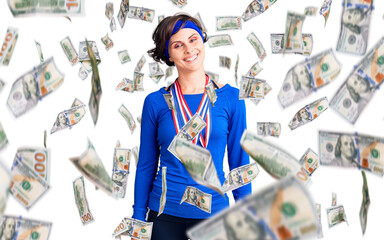 Beautiful young woman with short hair wearing winner medals looking positive and happy standing and smiling with a confident smile showing teeth