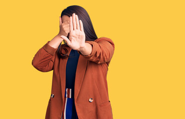 Sticker - Young beautiful brunette woman wearing elegant clothes covering eyes with hands and doing stop gesture with sad and fear expression. embarrassed and negative concept.