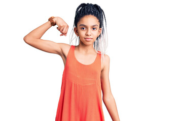 Sticker - Cute african american girl wearing casual clothes strong person showing arm muscle, confident and proud of power