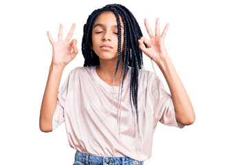 Sticker - Cute african american girl wearing casual clothes relax and smiling with eyes closed doing meditation gesture with fingers. yoga concept.