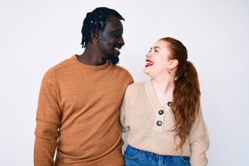 Sticker - Interracial couple wearing casual clothes smiling looking to the side and staring away thinking.