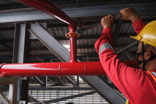 Install Fire Sprinkler System. In The Industrial Plant, Pipe Assembly, Red Fire Pipe, Fire Protection Contractors Using Scissor Lift High Work