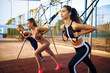 © Nomad_Soul - Slim women doing exercise, outdoors group training