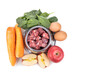 Overhead view of barf raw food ingredients recipe for dogs consisting meat, vegetable and egg