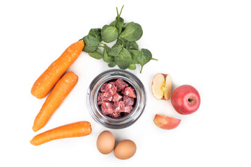 Wall Mural - Overhead view of barf raw food ingredients recipe for dogs consisting meat, vegetable and egg