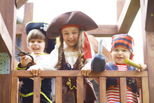 Children's Party In A Pirate Style. Children In Pirate Costumes Are Playing On Halloween.