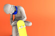 © Magnetu - Minimal earphone wireless headset on a boy with thorn statue with skateboard, Concept 3D rendering with copy space for text and pastel background Creative surrealism arts