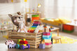 © New Africa - Set of different cute toys on wooden table in children's room