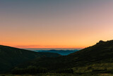 Fototapeta Niebo - Picturesque landscapes of the Carpathians, before sunrise there is a light fog, sunrise in Montenegro.