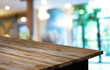 © Charlie's - Wood Table Top in Blur Background room interior with empty copy space.