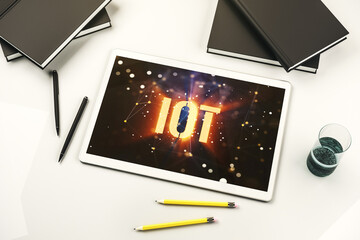 Poster - Creative IOT hologram on modern digital tablet screen, internet of things concept. Top view. 3D Rendering