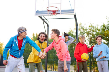 Wall Mural - two basketball teams, rivals play with each other. young caucasian boys confront, want to win. at sport playground