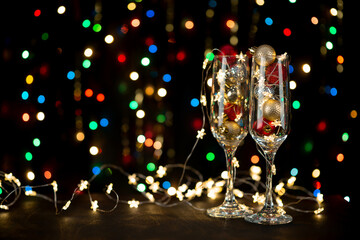 New year's holiday composition background with champagne glasses and bokeh