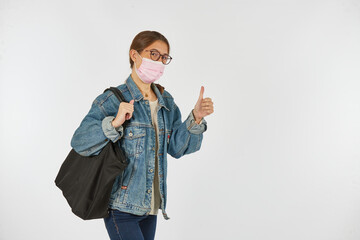 Wall Mural - University student ready to study with a mask due to the covid-19 pandemic