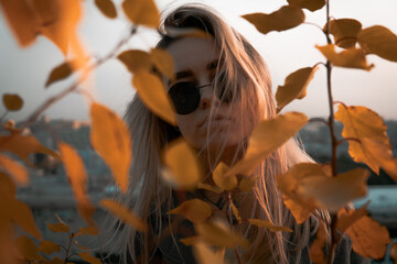 Portrait of a girl in yellow foliage