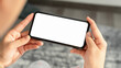 © sompong - Woman hand holding smartphone and the screen is blank, social network concept, copy space for your advertising.