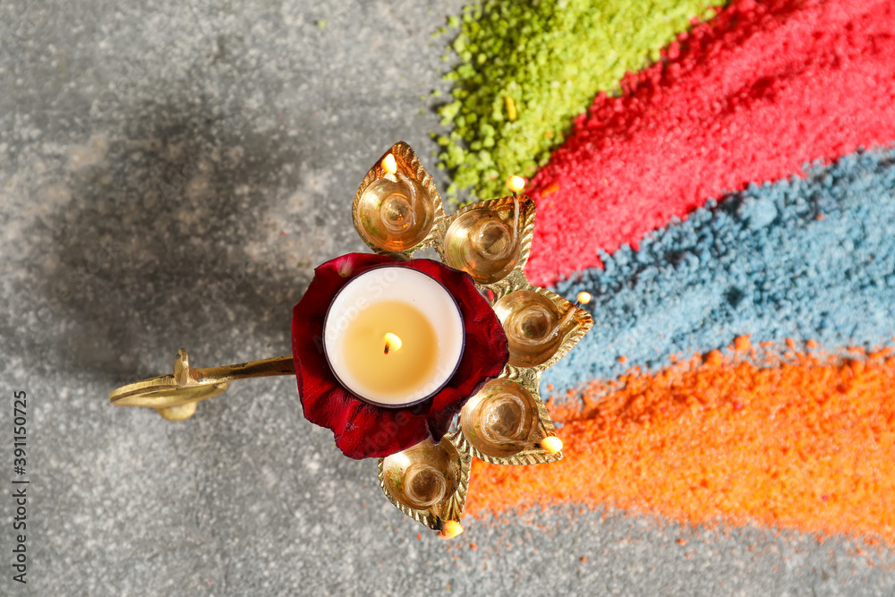 Diya lamp for celebration of Divaly on grey background
