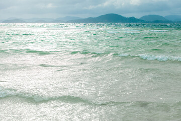 blue sea and mountain on cloud