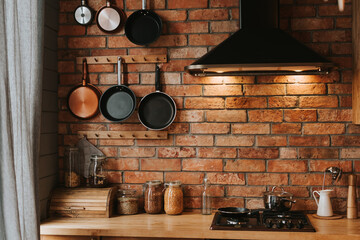 Wall Mural - details of a cozy kitchen interior with a brick wall