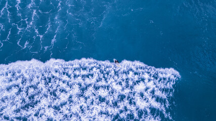 Wall Mural - aerial surfer in sea