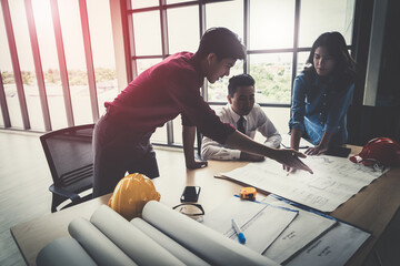 Wall Mural - Construction team engineer and architect is brainstorming on working table with building plan