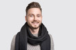 © kite_rin - Portrait of handsome smiling young man wearing warm winter clothing. Laughing cheerful men studio shot. Isolated on gray background. People, male beauty, winter concept