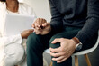 © Drazen - Close-up of supportive psychotherapist holding hand of a anxious patient.