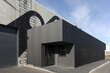 © Mint Images - Side of a Modern Factory Building