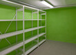© Mint Images - Basement Storage Room with empty shelves