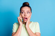 Close-up portrait of her she nice attractive lovely pretty charming gorgeous stunned wondered girl talking on phone getting bad news isolated bright vivid shine vibrant blue color background