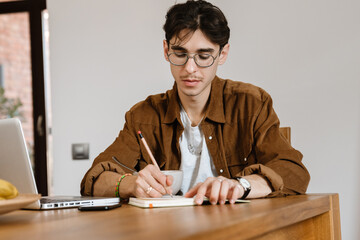 Handsome man using laptop computer
