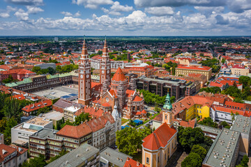 Szeged, Hungary - Aerial view of the Votive Church and Cathedral of Our Lady of Hungary (Szeged Dom) on a sunny summer day with blue sky and clouds