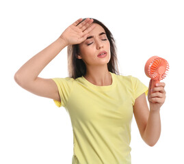 Canvas Print - Woman with portable fan suffering from heat on white background. Summer season