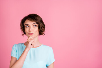 Poster - Photo of dreamy sweet woman wear casual blue t-shirt look empty space arm chin isolated pink color background