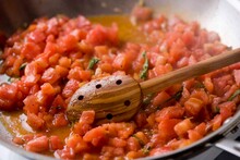 Close Up Of Boiling Tomato Sauce On Pan