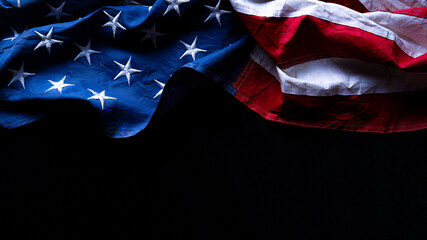 Wall Mural - US American flag against black background. For Memorial, Presidents, Veterans, Labor, Independence or 4th of July celebration day. Top view, copy space for text.