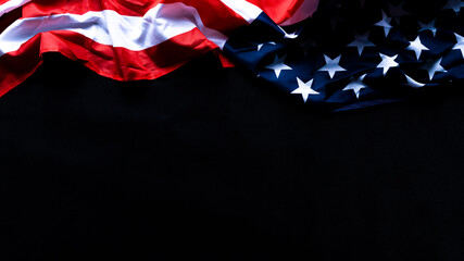 Wall Mural - US American flag against black background. For Memorial, Presidents, Veterans, Labor, Independence or 4th of July celebration day. Top view, copy space for text.