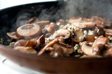 Close Up Of Cooked Cremini Mushrooms On Pan