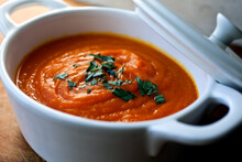 Carrot And Sweet Potato Soup With Mint Or Tarragon In Pot