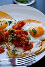 Close Up Of Fried Eggs With Salsa