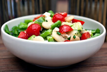 Greek Salad With Giant Beans And Arugula In Bowl